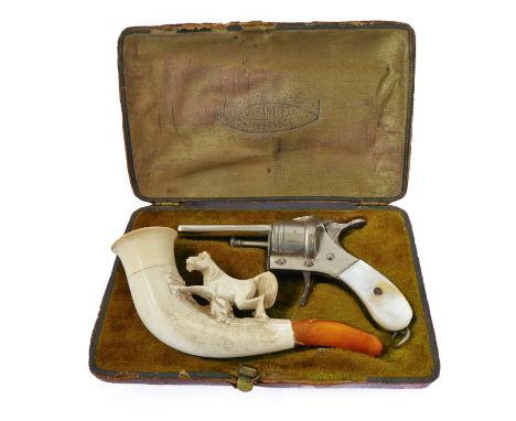 A cased mid 19th century German carved meerschaum pipe together with a 'pistol' cigar cutter