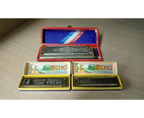 Three Hohner harmonicas