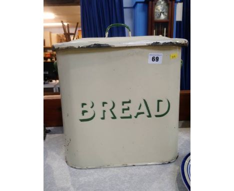 An enamel bread tin