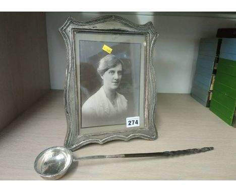 Silver picture frame and a Toddy ladle