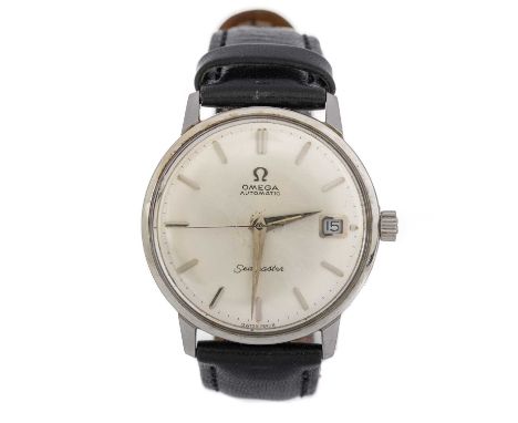 OMEGA SEAMASTER STAINLESS STEEL MANUAL WIND WRIST WATCH  the round dial with baton hour markers, 33mm case, on a black leathe