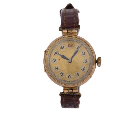 NINE CARAT GOLD MANUAL WIND WRIST WATCH, the round dial with Arabic hour markers, 27mm case, on a burgundy leather strap, lac