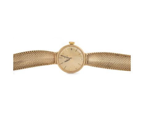 OMEGA, NINE CARAT GOLD MANUAL WIND WRIST WATCH the round dial with baton hour markers, 18mm case, on a nine carat gold bracel
