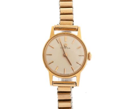 OMEGA, EIGHTEEN CARAT GOLD CASED MANUAL WIND WRIST WATCH the round dial with baton hour markers, 19mm case, on a gold plated 