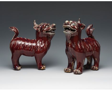 Pair of Foo "sang de boeuf" dogs, Qing dynasty. China, 19th century.Hand-polychromed porcelain.Red export wax seals on the ba