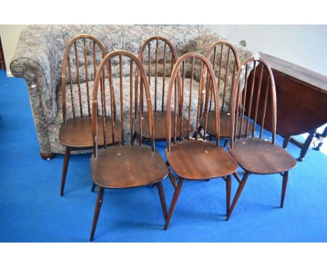 A set of six Ercol high hoop and stick back kitchen chairs in dark stain with H stretchers