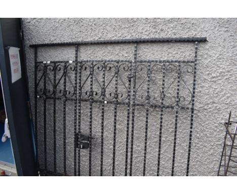 A wrought iron drive way gate and fence (no key)