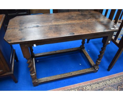 A Period oak side table in the Stuart style having canted edges on barley twist legs (been adapted with no additional leaves 