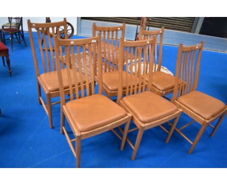 A set of six Ercol Penn classic dining chairs having upholstered leather seats and rail back, currently retail at £575 each