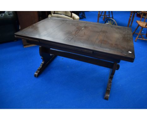 A Priory style oak drawer leaf refectory style dining table, probably Ercol