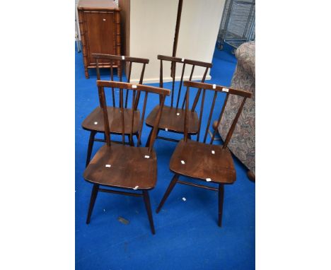 A set of four vintage Ercol spindle back kitchen chairs in dark stain