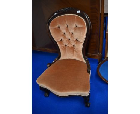A Victorian mahogany framed nursing chair having later button back upholstery