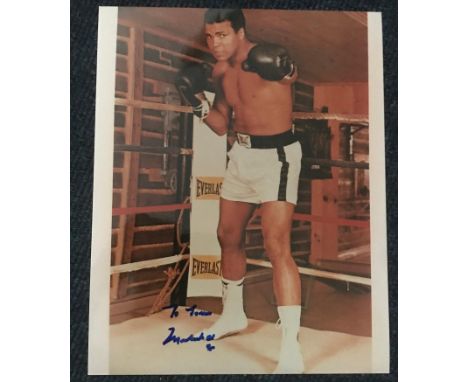 Muhammad Ali signed 10 x 8 inch colour photo in the ring, dedicated. Condition 8/10. Good Condition. All autographs come with