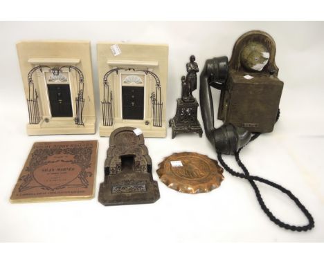 Early wooden Bakelite telephone, spelter figure, soapstone carved item and a pair of Timothy Richards bookends (at fault) 