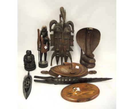 Carved wooden cobra figure, together with a quantity of various African carvings and a rectangular carved wooden portrait pla