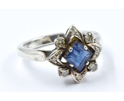 Dress ring set square sapphire and diamonds in a white metal mount 