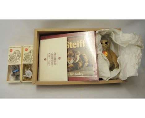 Steiff 1998 teddy bear in burgundy, another teddy bear with book, a celebration of Steiff special edition and two small boxed