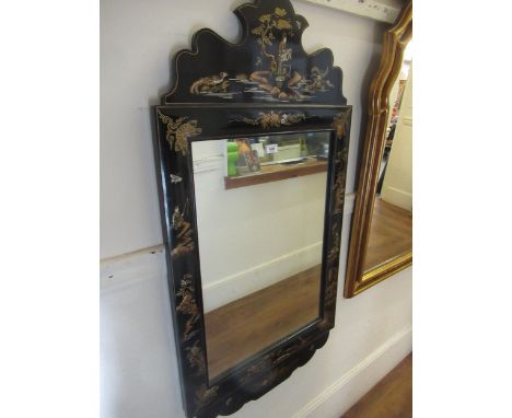 20th Century Chinese black lacquered chinoiserie decorated rectangular wall mirror with shaped surmount, decorated with vario
