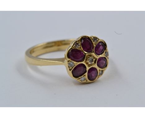 9ct Gold flowerhead dress ring set amethysts and diamonds 