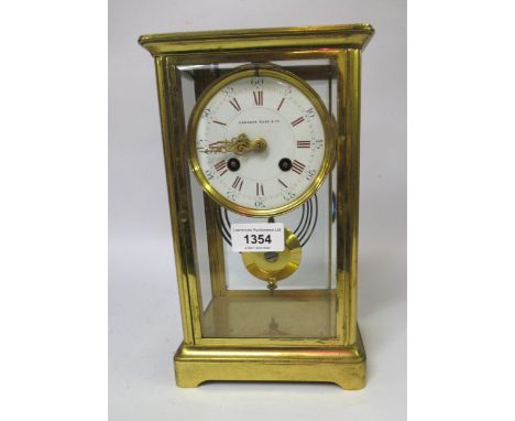 Early 20th Century gilt brass four glass library clock, the enamel dial with red Roman and black Arabic numerals, signed Came