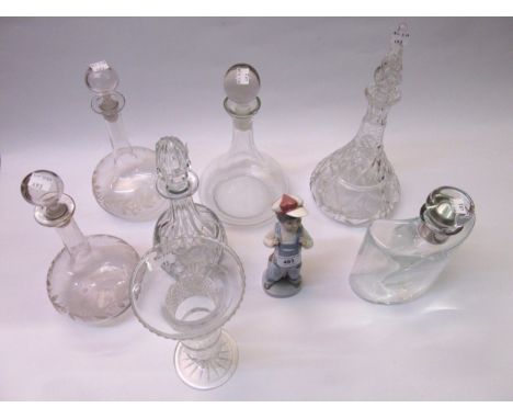 Lladro figure of a boy in dungarees, together with six various glass decanters and a cut glass vase 