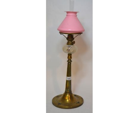 Art nouveau brass oil lamp with a pink shade and opalescent glass well, the base with applied enamel decoration (with losses)