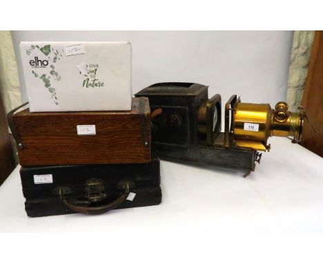 19th Century brass and black japanned magic lantern, together with a quantity of loose glass slides and an oak case containin