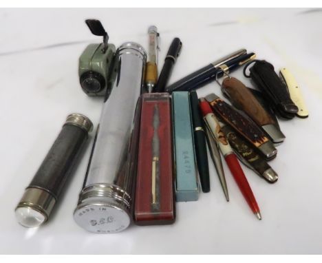 Five various pen knives, three early torches and a small quantity of pens and pencils 