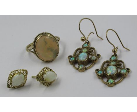 9ct Gold oval opal set ring, together with a pair of opal set eardrops and another pair of opal set ear studs 