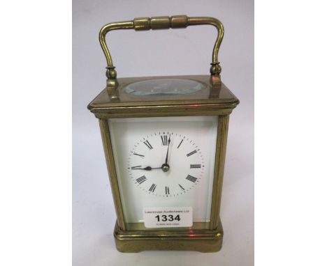 French gilt brass carriage clock, the enamel dial with Roman numerals, with a two train movement striking on the half hourNot