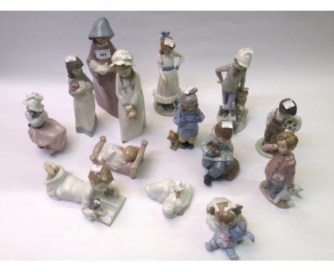 Fourteen Nao figures of young boys and girls 