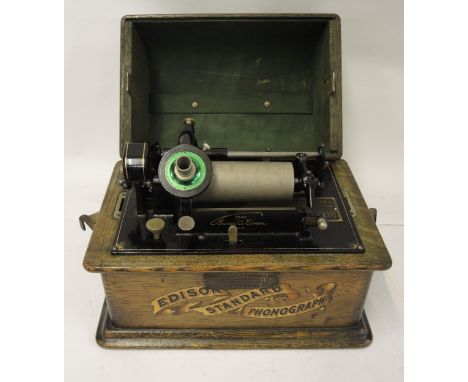 Early Edison standard phonograph in oak case with silvered horn, together with a large quantity of various cylinderscylinders