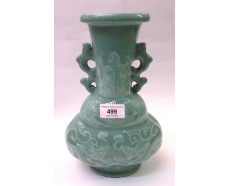 Chinese Celadon two handled vase, relief moulded with dragons (drilled to base), 28cm highSome firing marks. Checked for dama