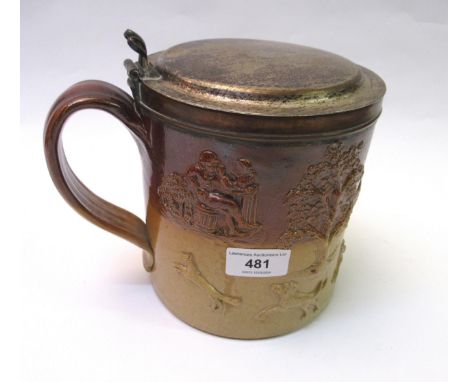 Large 19th Century harvest tankard, relief moulded with hunting dogs and figures, silver plated cover, 17cm highSlightly miss