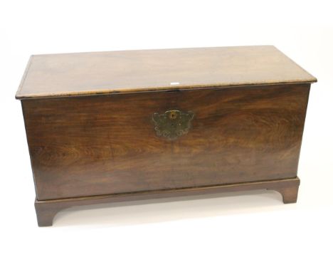 Large 19th Century mahogany trunk having single plank top with original escutcheons and side handles on bracket feet, 70cm hi