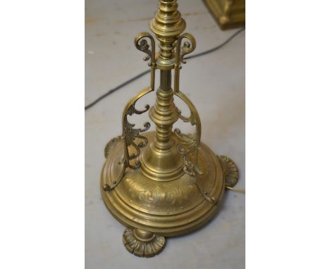 Late 19th / early 20th Century brass oil lamp standard with ornate tripod base, 164cm high overall including shades 