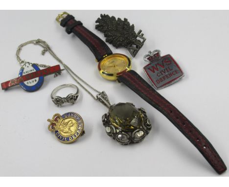 Silver mounted smoky quartz pendant on chain, silver dress ring, four lapel badges and a ladies wristwatchAF badge has some m