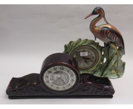 Unusual porcelain mantel clock in the form of a heron with lustre finish, together with another porcelain cased mantel clock 