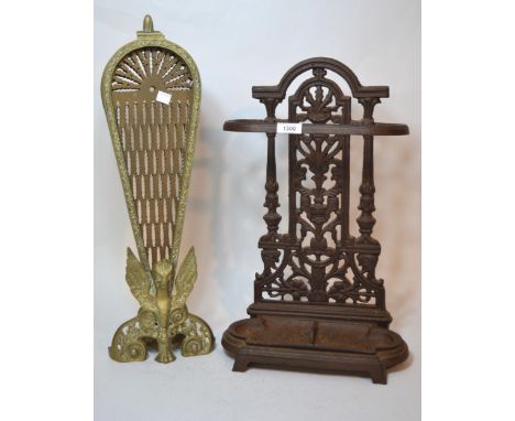 Brass folding firescreen of peacock design, and a modern patinated cast iron stick stand with drip tray 
