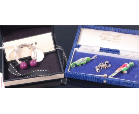 A boxed Links of London silver keyring; together with three various pendants including an enamel set parrot example (4)