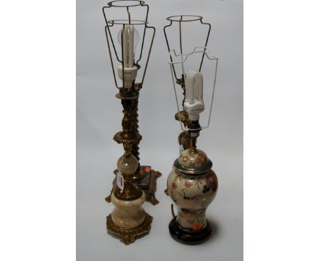 A modern table lamp having faux marble barley twist column and brass Corinthian capitals, together with a pair of onyx gilt m