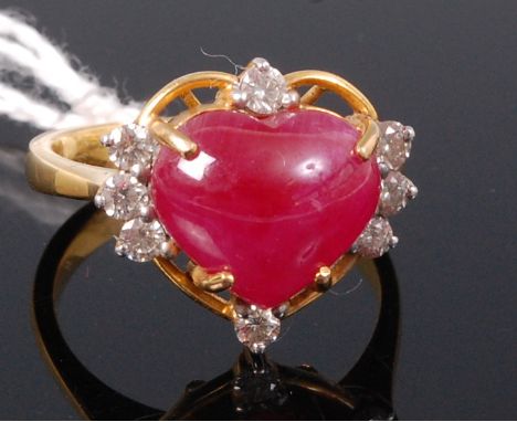 A yellow metal, heart shaped ruby and white sapphire set dress ring, size M/N