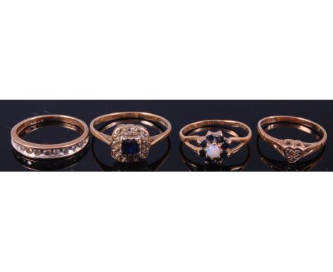 A ladies 9ct gold and diamond set half eternity ring, size J/K; together with three other ladies 9ct gold gem-set dress rings