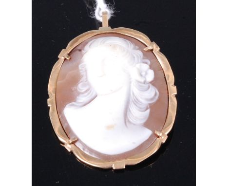 A carved shell cameo brooch, depicting bust portrait of a maiden with flower in her hair, in 9ct gold mount, 4cm