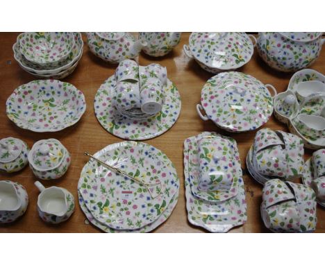 An extensive Queens bone china part tea and dinner service in the Country Meadow pattern