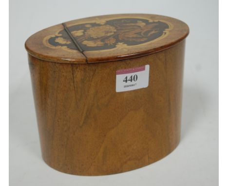 A 19th century walnut tea caddy, of oval form, the hinged lid with floral marquetry inlay opening to reveal lined interior