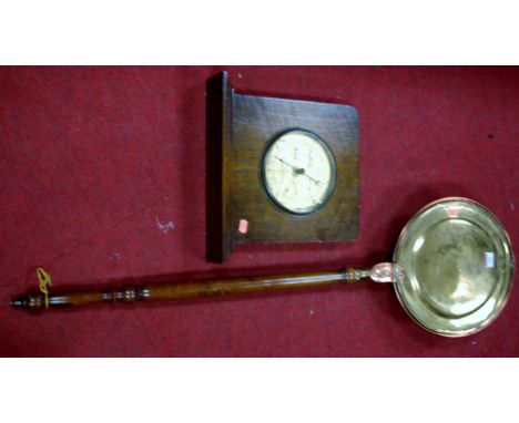 An early 20th century copper and brass warming pan; together with an oak cased barometer (a/f) (2) 