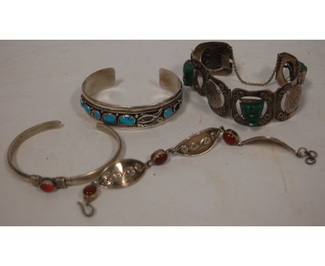 A ladies sterling silver and turquoise set bangle together with three other ladies silver bangles (4)