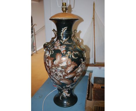 A pair of large ceramic table lamps in the Japanese taste, heightened in gilt with raised dragon decoration ***AND a pair of 