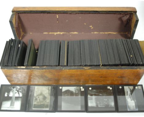 A large collection of late 19th century magic lantern slides to include topographical views in fitted oak box